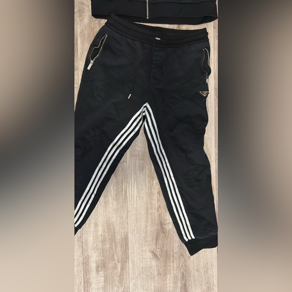 Prada sweatsuit as is . Worn in fair condition .